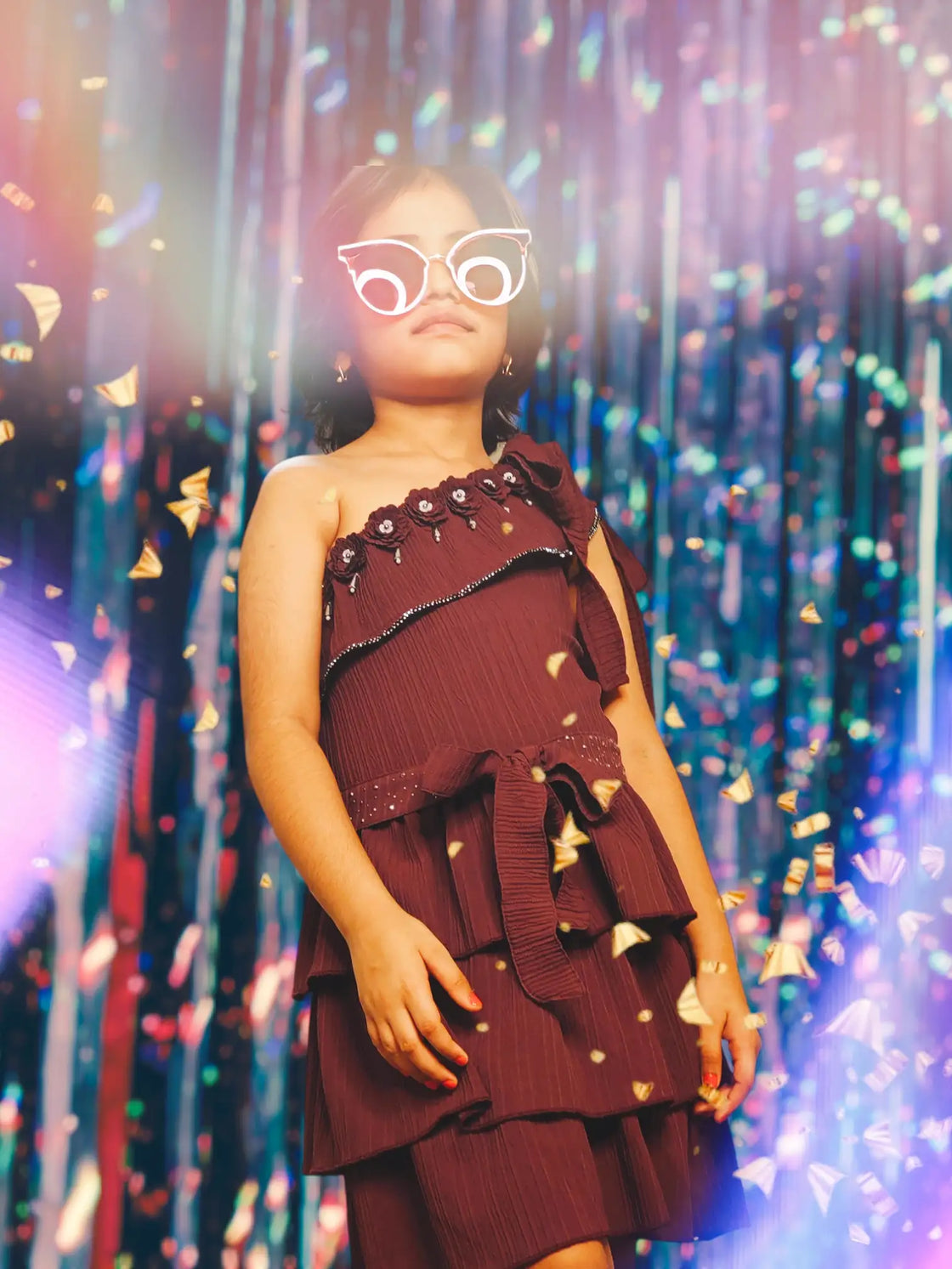 Eurynome Kidswear Girls—A super-luxe, princess-inspired masterpiece: hand-crafted floral accents, shimmering accessories, and a silver-studded belt bring royal elegance to every tier. Truly a queen’s dress for ages 3–9