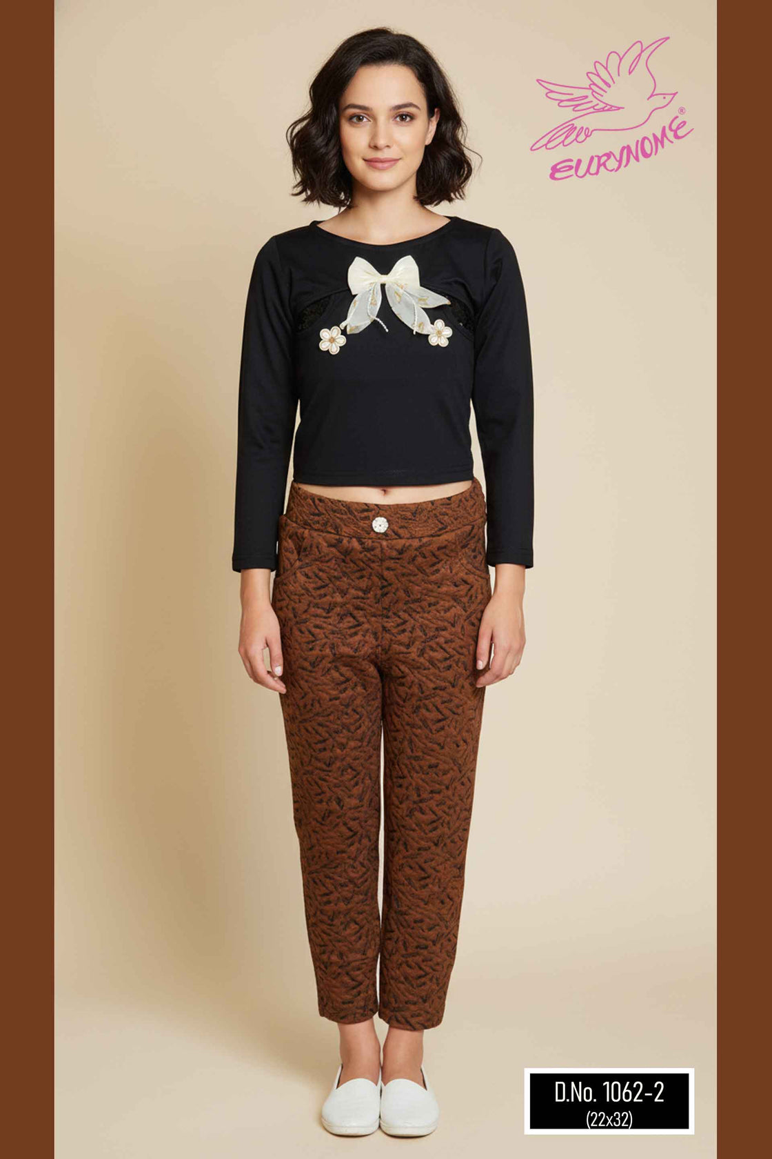 Eurynome Kidswear Girls—Sequin-styled black tencel top with butterfly and flower embellishments, paired with textured woven animal-pattern jeggings. Nature meets fashion for ages 3–9.