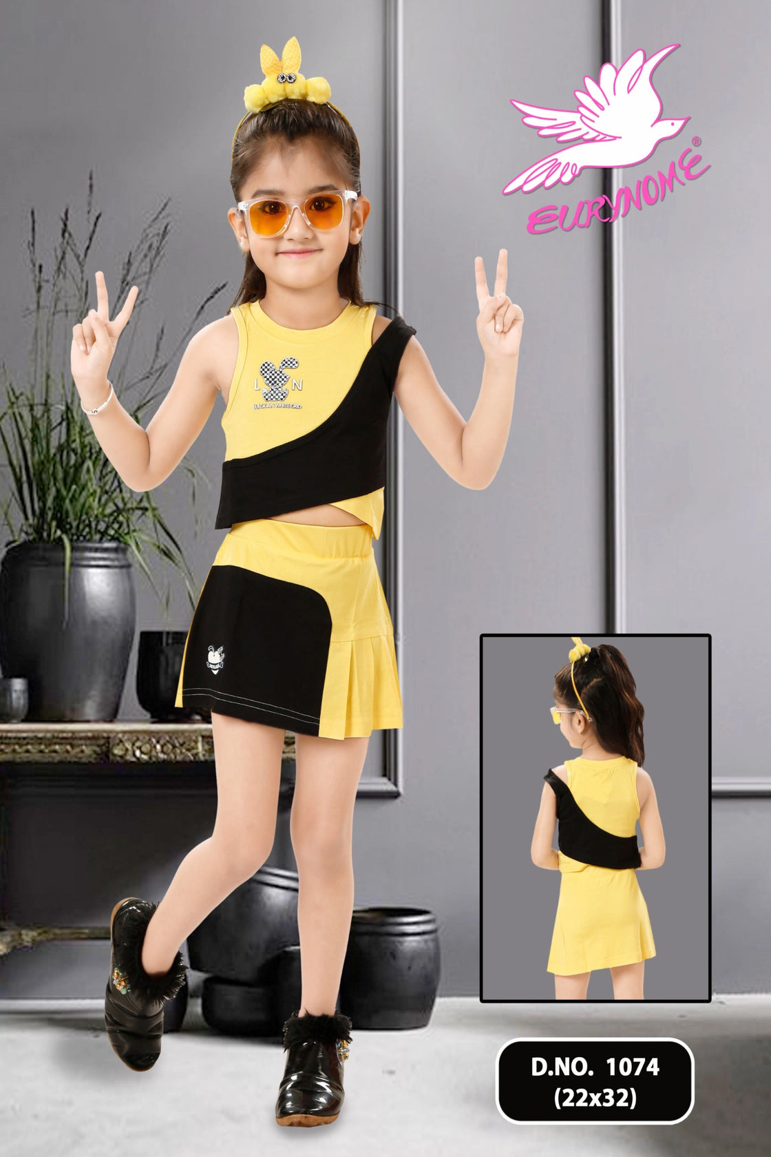 Eurynome Kidswear Girls—Game on! This double shoulder tennis set features bold panels and quirky 3D stickers, serving up playful, sporty style for energetic girls, Ages 3–9.