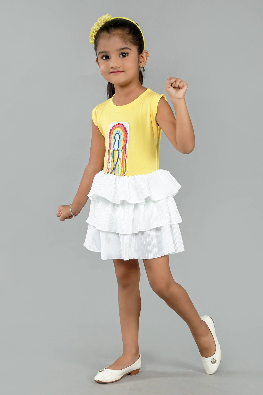 Eurynome Kidswear Girls—Super soft tencel top with hand-crocheted rainbow, paired with a striking white multi-flair skirt. Vibrant, breezy, and perfect for outdoors ages 1–9