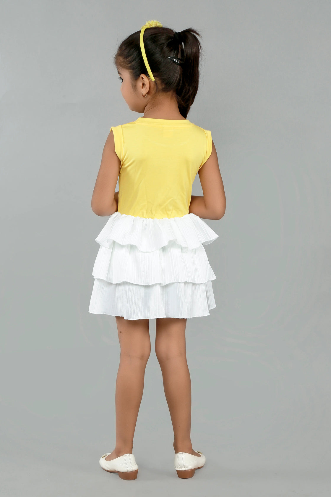 Eurynome Kidswear Girls—Super soft tencel top with hand-crocheted rainbow, paired with a striking white multi-flair skirt. Vibrant, breezy, and perfect for outdoors ages 1–9