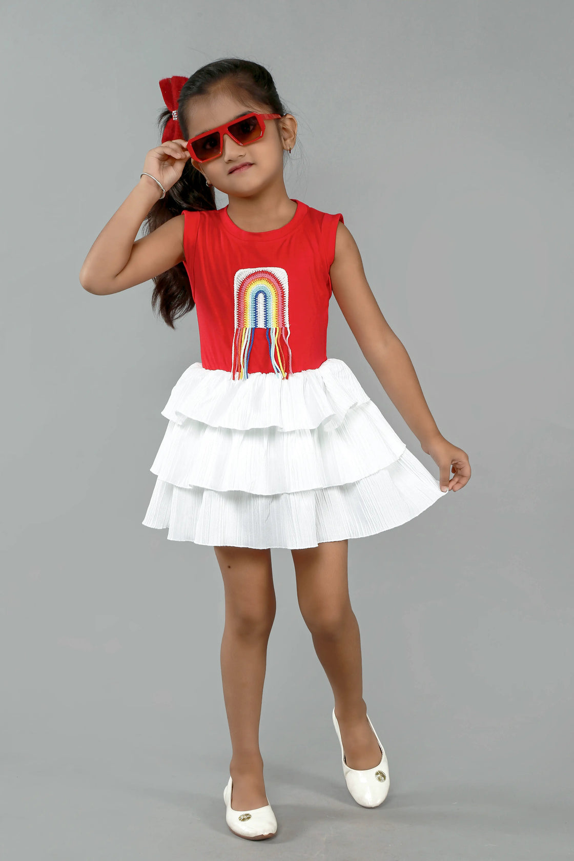 Eurynome Kidswear Girls—Super soft tencel top with hand-crocheted rainbow, paired with a striking white multi-flair skirt. Vibrant, breezy, and perfect for outdoors ages 1–9