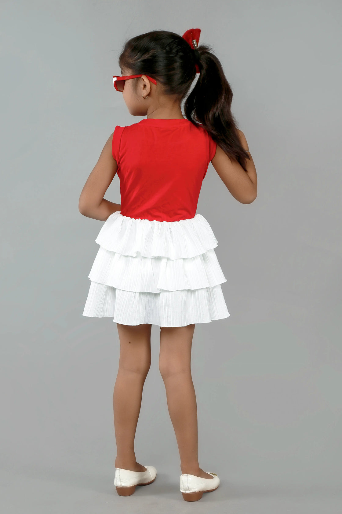 Eurynome Kidswear Girls—Super soft tencel top with hand-crocheted rainbow, paired with a striking white multi-flair skirt. Vibrant, breezy, and perfect for outdoors ages 1–9