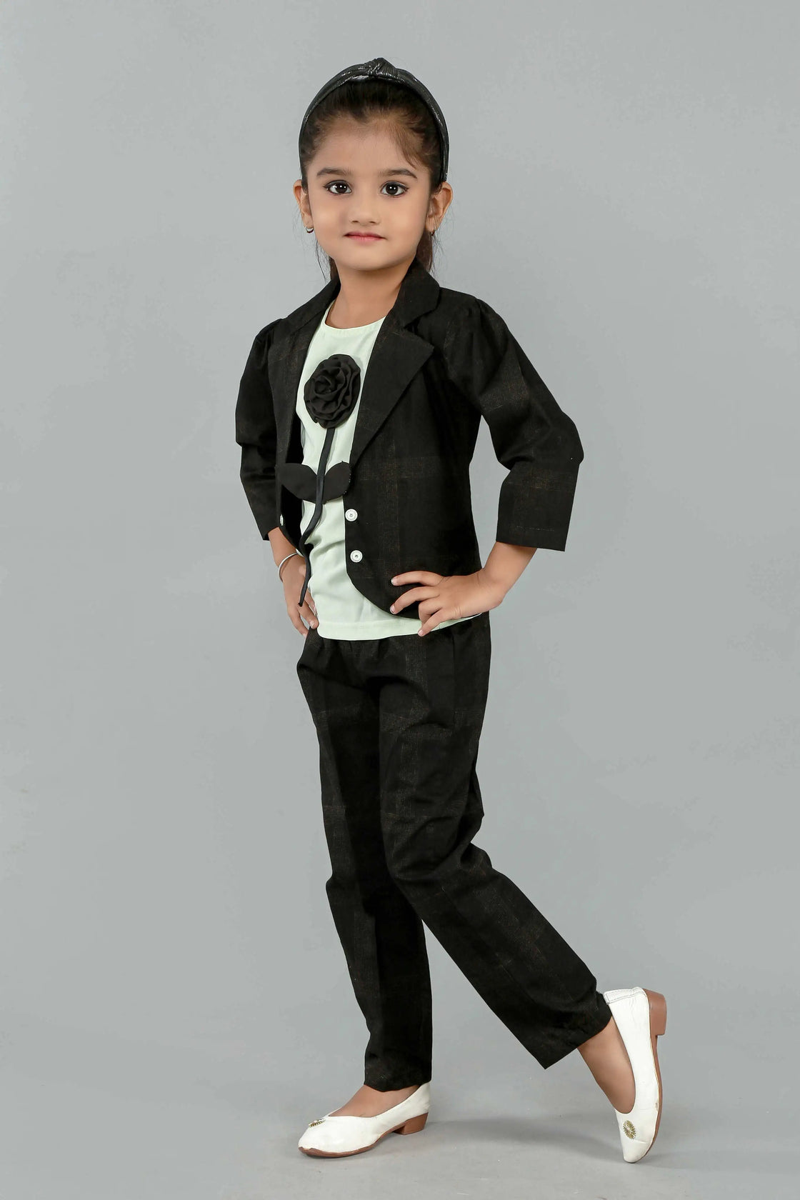 Eurynome Kidswear Girls—MIDNIGHT Black Rose series features a handmade center rose, crafting a bold, simple, and powerful noir statement for ages 3–9 .