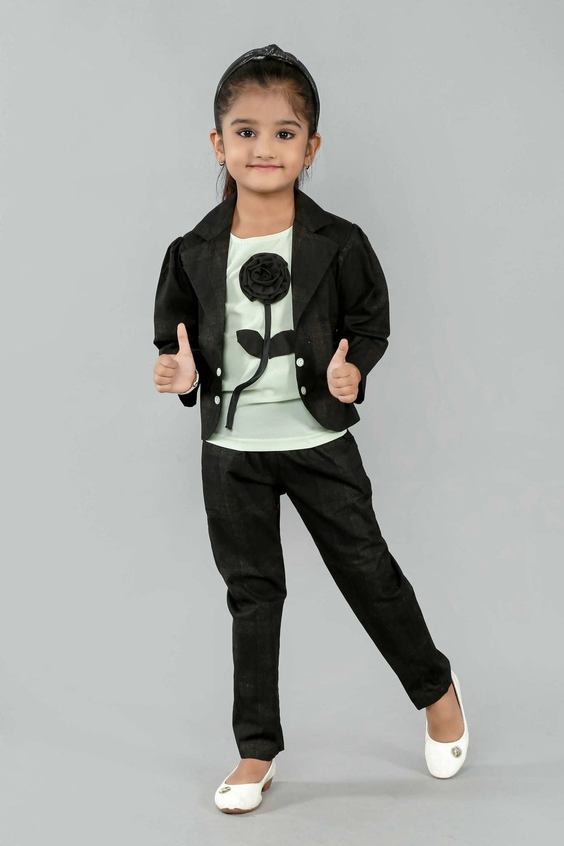 Eurynome Kidswear Girls—MIDNIGHT Black Rose series features a handmade center rose, crafting a bold, simple, and powerful noir statement for ages 3–9 .