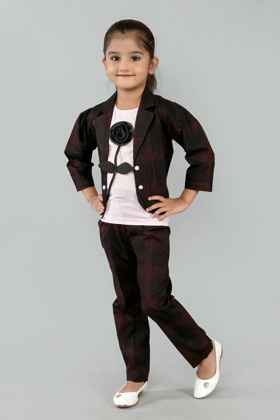 Eurynome Kidswear Girls—MIDNIGHT Black Rose series features a handmade center rose, crafting a bold, simple, and powerful noir statement for ages 3–9