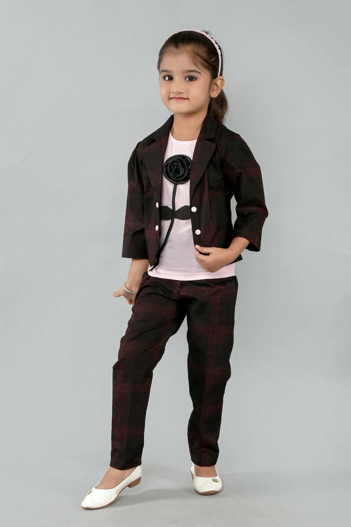 Eurynome Kidswear Girls—MIDNIGHT Black Rose series features a handmade center rose, crafting a bold, simple, and powerful noir statement for ages 3–9