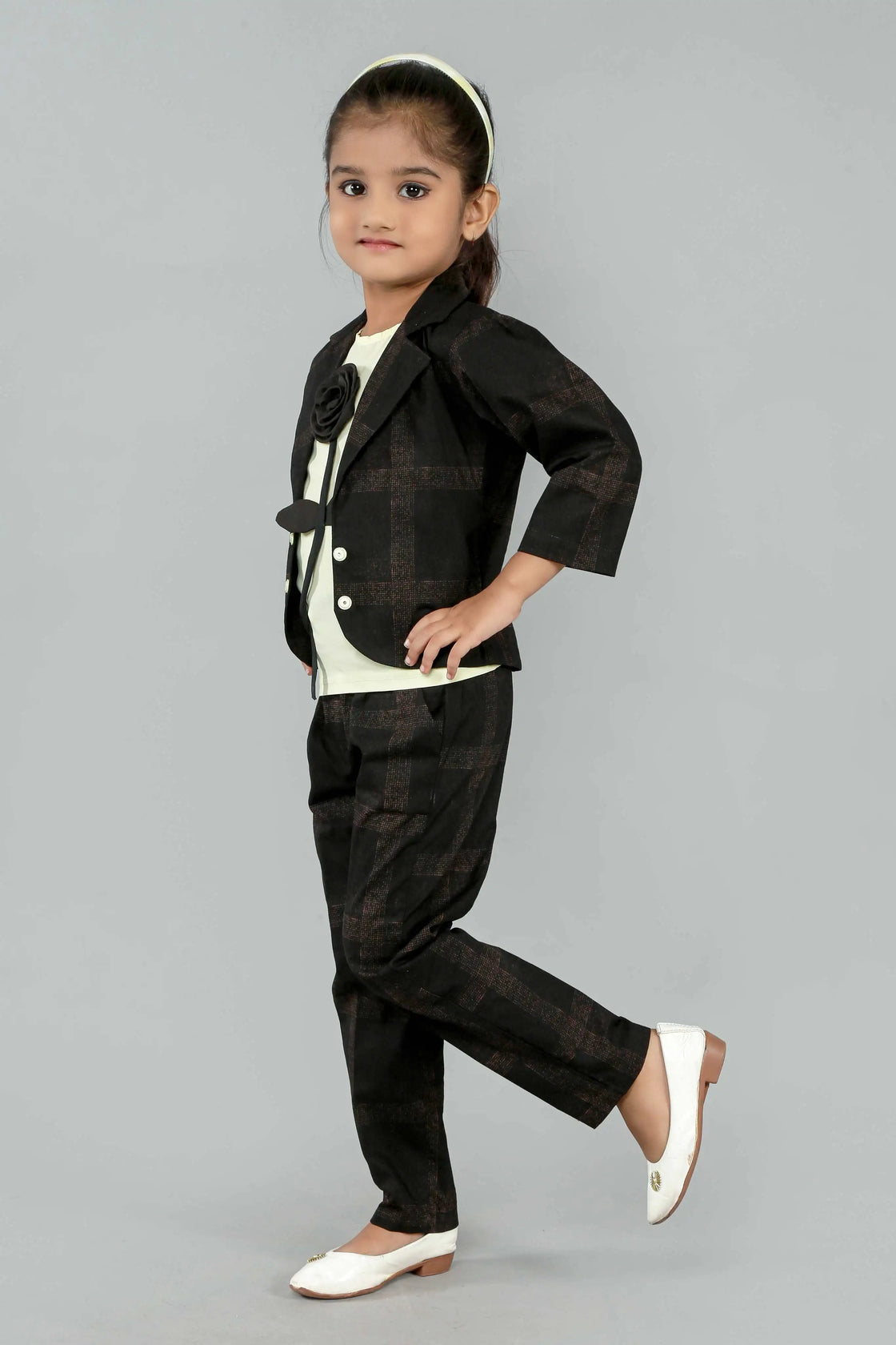 Eurynome Kidswear Girls—MIDNIGHT Black Rose series features a handmade center rose, crafting a bold, simple, and powerful noir statement for ages 3–9