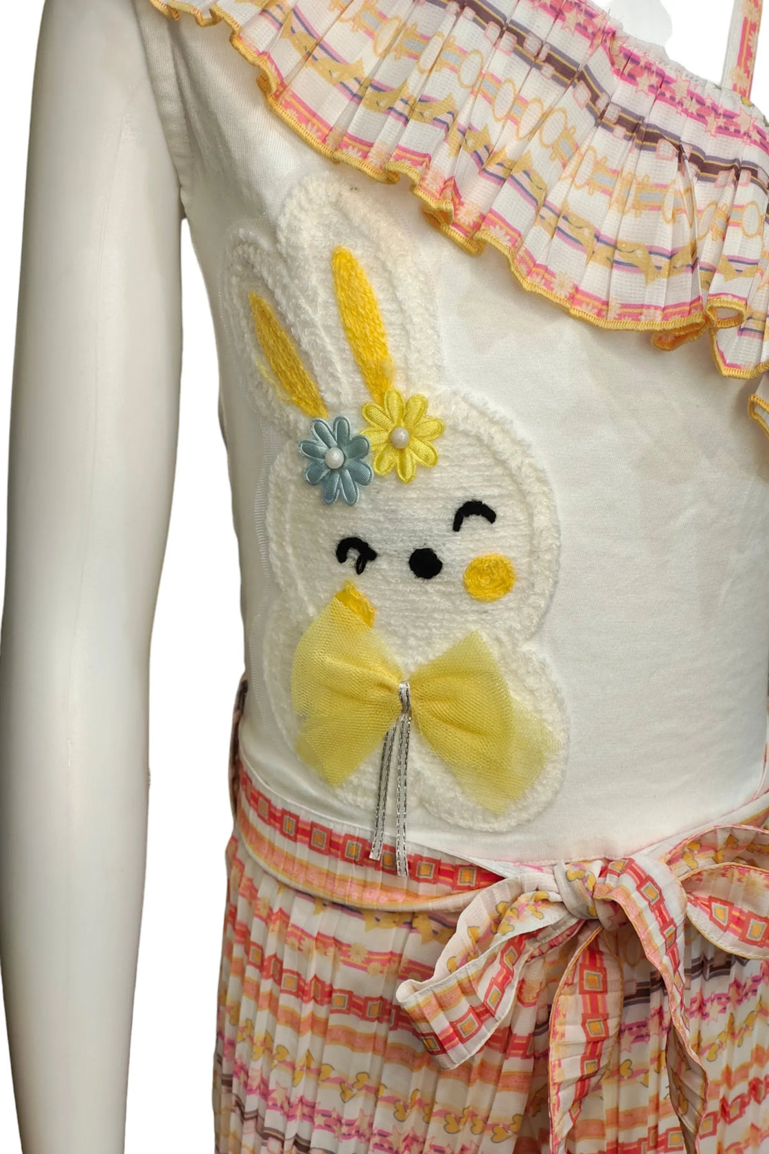 Eurynome Kidswear Girls – Asymmetric romper with chic single-shoulder, bunny detail, stylish belt, and pleated skirt flair. Perfect for standout style ages 3-9.