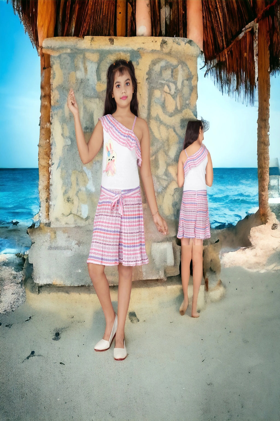 Eurynome Kidswear Girls – Asymmetric romper with chic single-shoulder, bunny detail, stylish belt, and pleated skirt flair. Perfect for standout style ages 3-9.