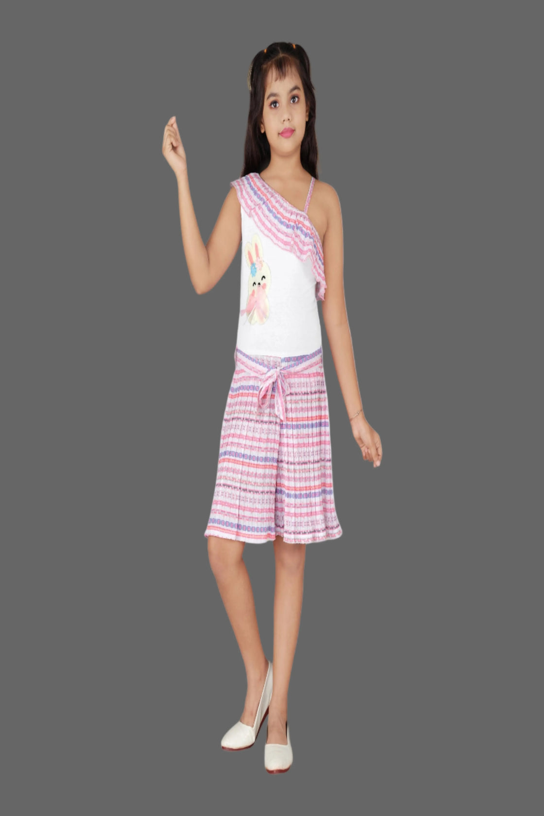 Eurynome Kidswear Girls – Asymmetric romper with chic single-shoulder, bunny detail, stylish belt, and pleated skirt flair. Perfect for standout style ages 3-9.