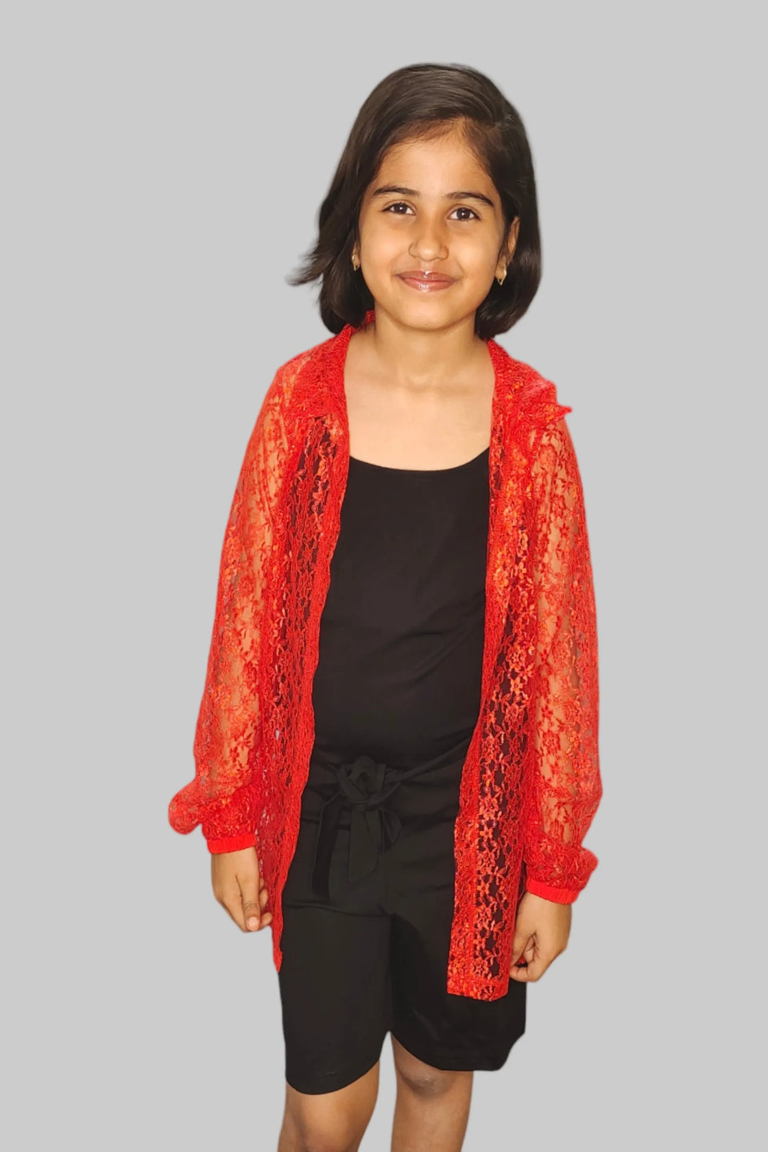 Eurynome Kidswear Girls—Eco-friendly jumpsuit with comfy cloth belt, layered under a luxe floral crocheted long shirt. Trendy, elegant, and effortless party style