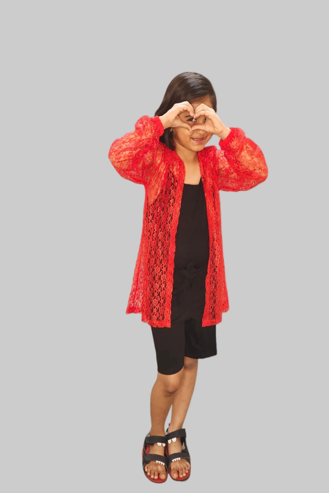 Eurynome Kidswear Girls—Eco-friendly jumpsuit with comfy cloth belt, layered under a luxe floral crocheted long shirt. Trendy, elegant, and effortless party style