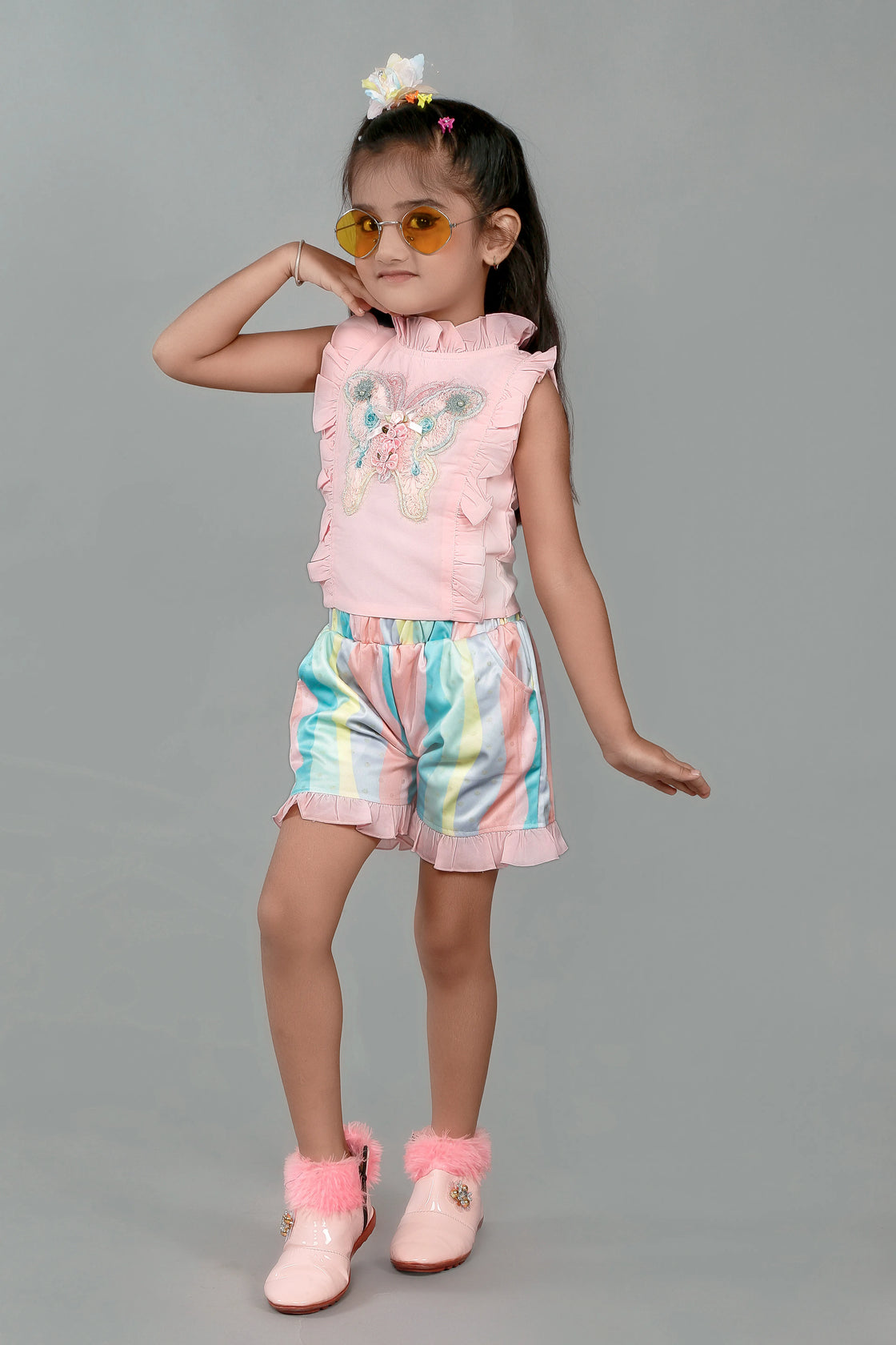 Eurynome Kidswear Girls – Ruffle top & pastel short set, butterfly appliqué, foil wave shorts, comfy chic for ages 3-9.