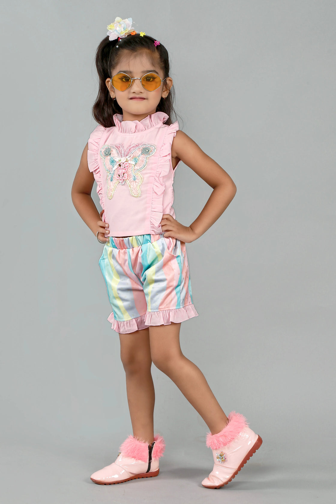 Eurynome Kidswear Girls – Ruffle top & pastel short set, butterfly appliqué, foil wave shorts, comfy chic for ages 3-9.