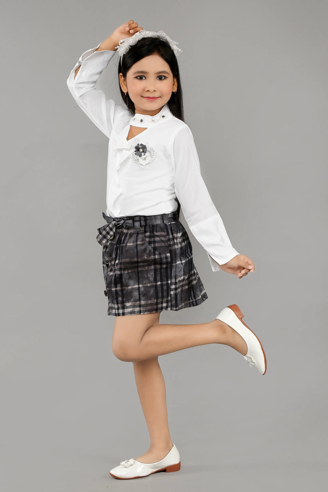 Eurynome Kidswear Girls – Lounge-Ready Round Neck Skirt & Top Set, Frilled Sleeves, Hand Embroidered Floral Broach, Extra Soft Checked Mini Skirt, Flower Knot Belt, Relaxed Chic Ages 3-6.