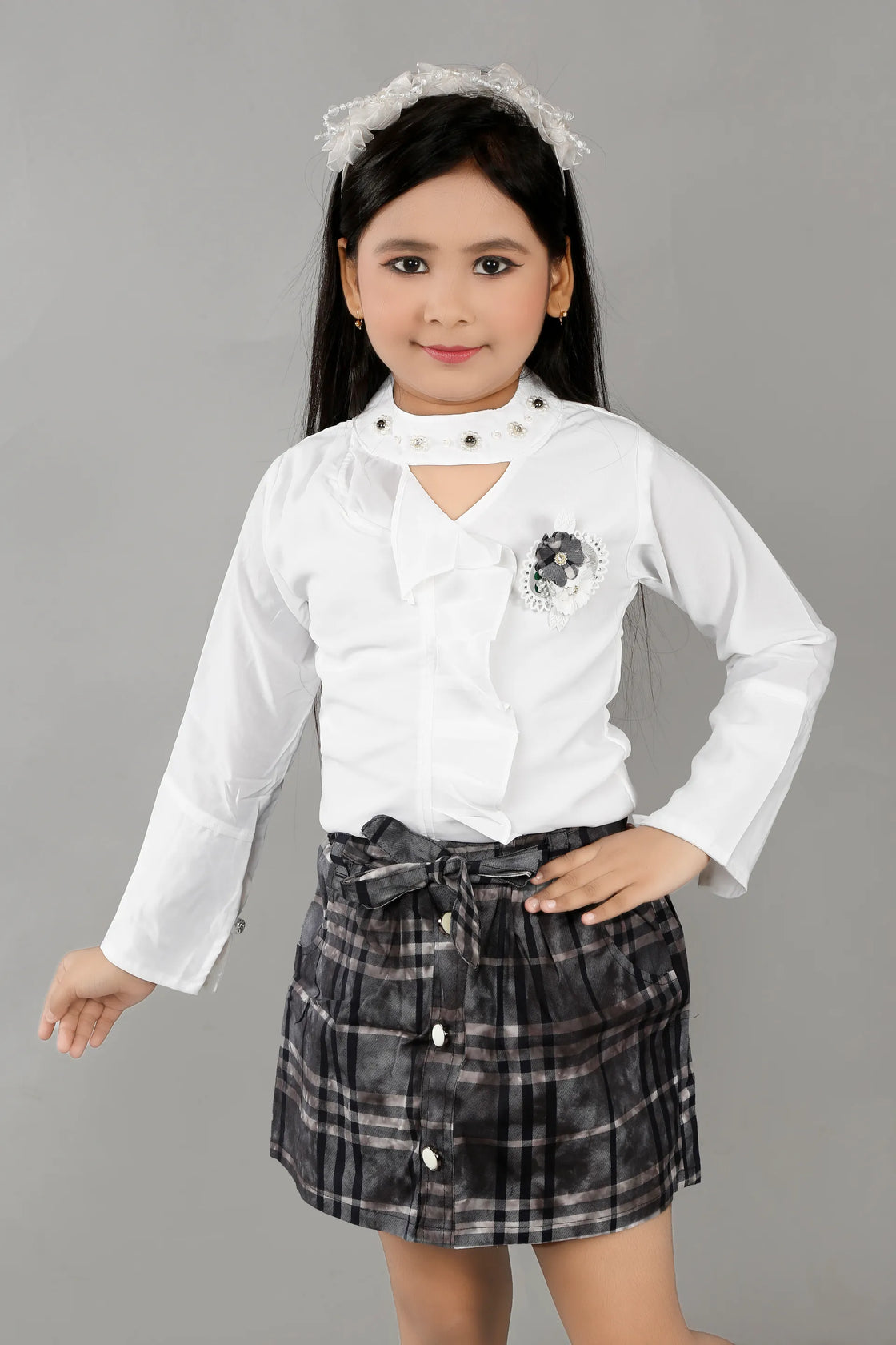 Eurynome Kidswear Girls – Lounge-Ready Round Neck Skirt & Top Set, Frilled Sleeves, Hand Embroidered Floral Broach, Extra Soft Checked Mini Skirt, Flower Knot Belt, Relaxed Chic Ages 3-6.