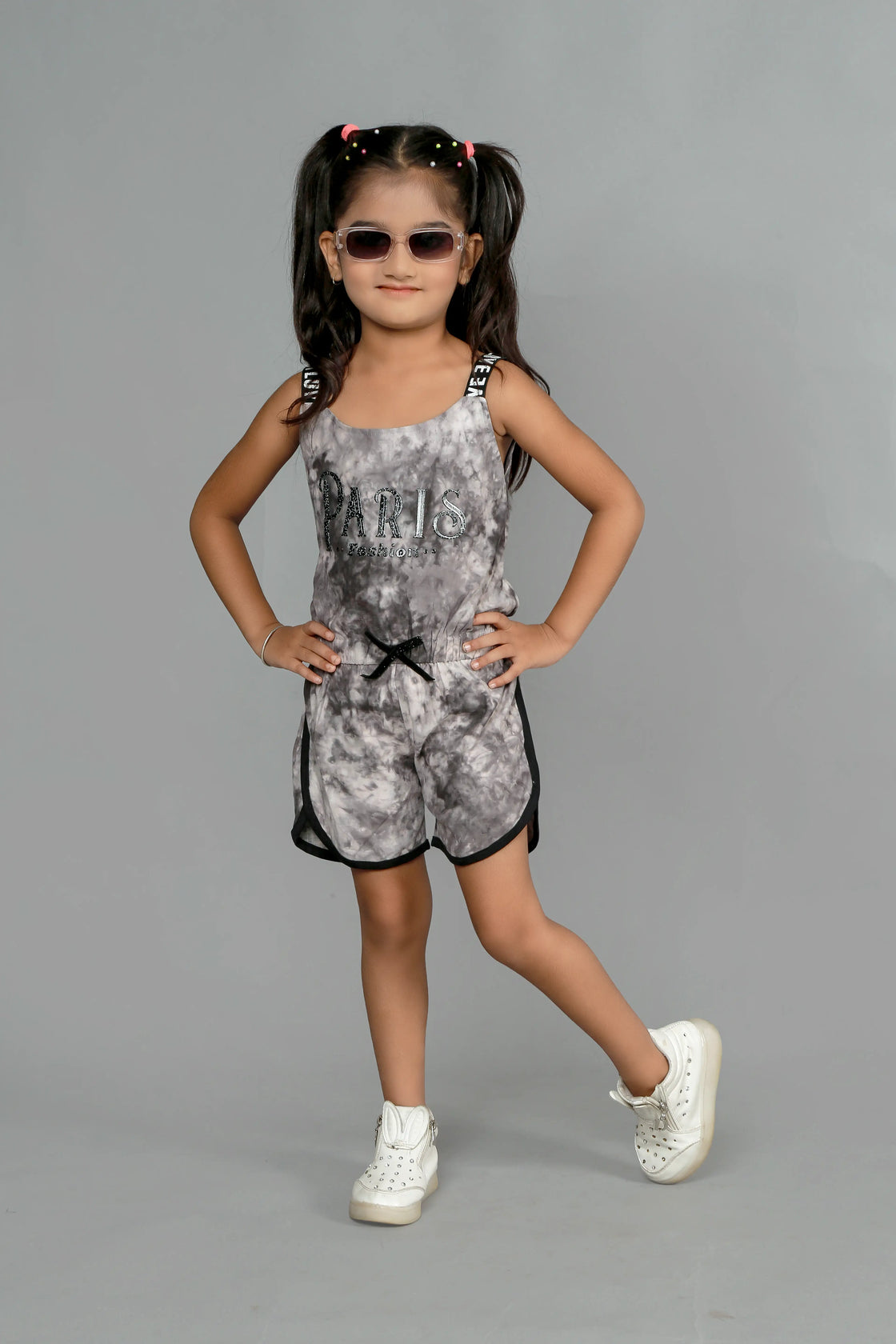 Eurynome Kidswear Girls – Tie Dye Paris Romper, Soft cotton, love lace straps, chic bow, adventure-ready fit. Ages 3-6